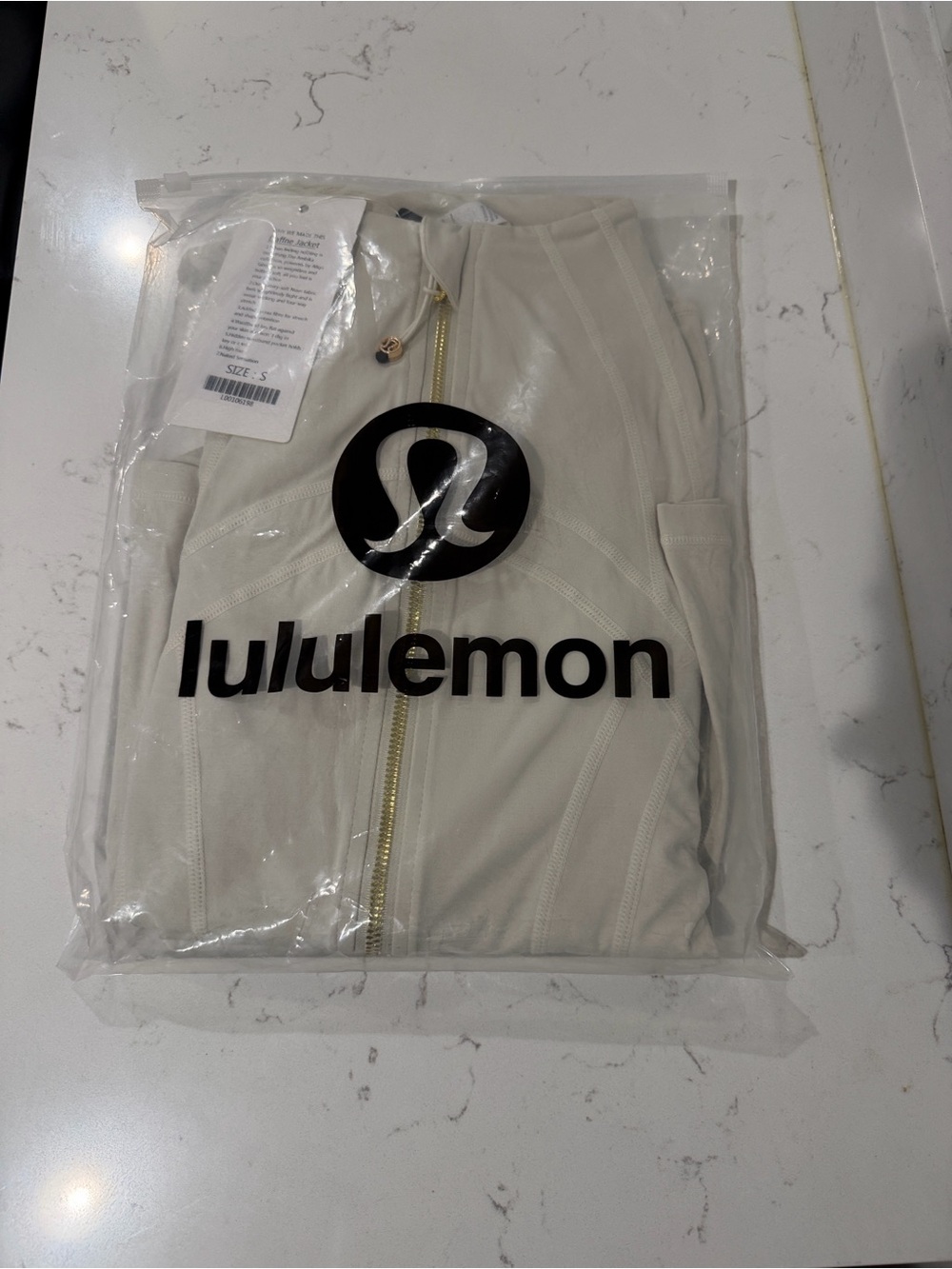 Lululemon Cream Zip-Up Jacket with matching color yoga pants